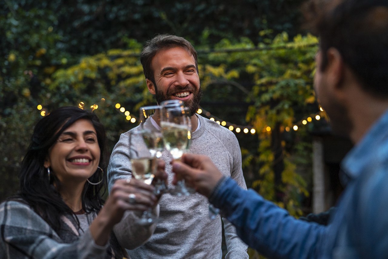 Three people toasting the champagne