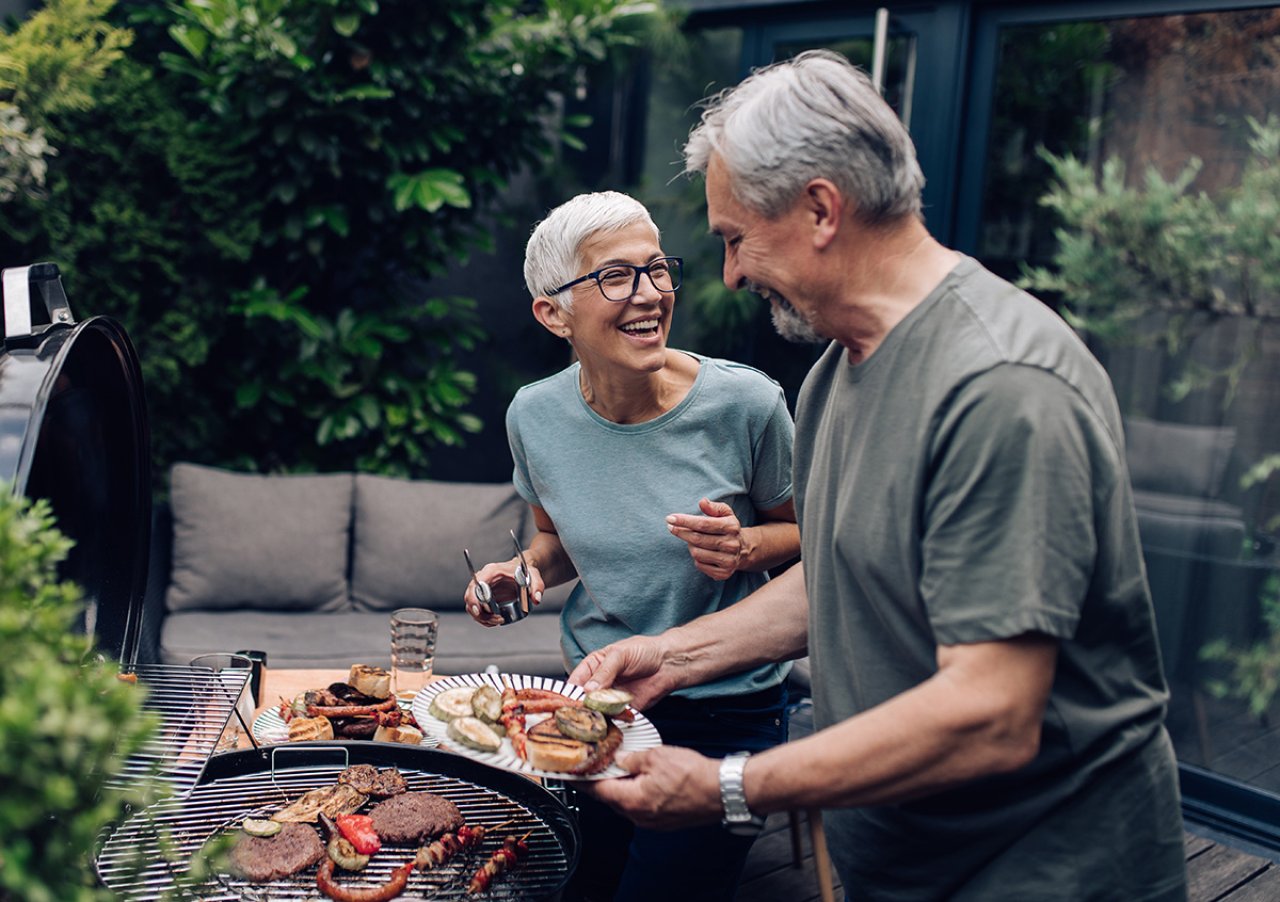 Older couple cooking food